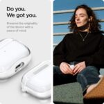 Apple AirPods 3 inside clear Spigen case showing charging port cutout